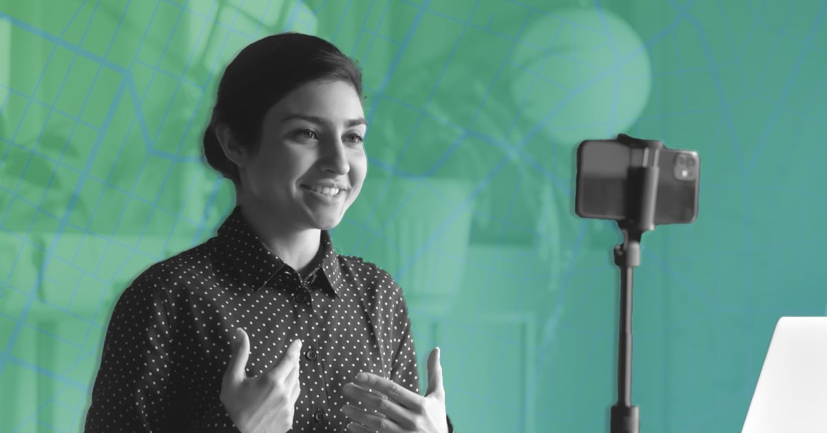 woman taking video with phone