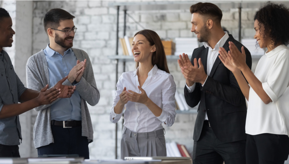 coworkers clapping for someone