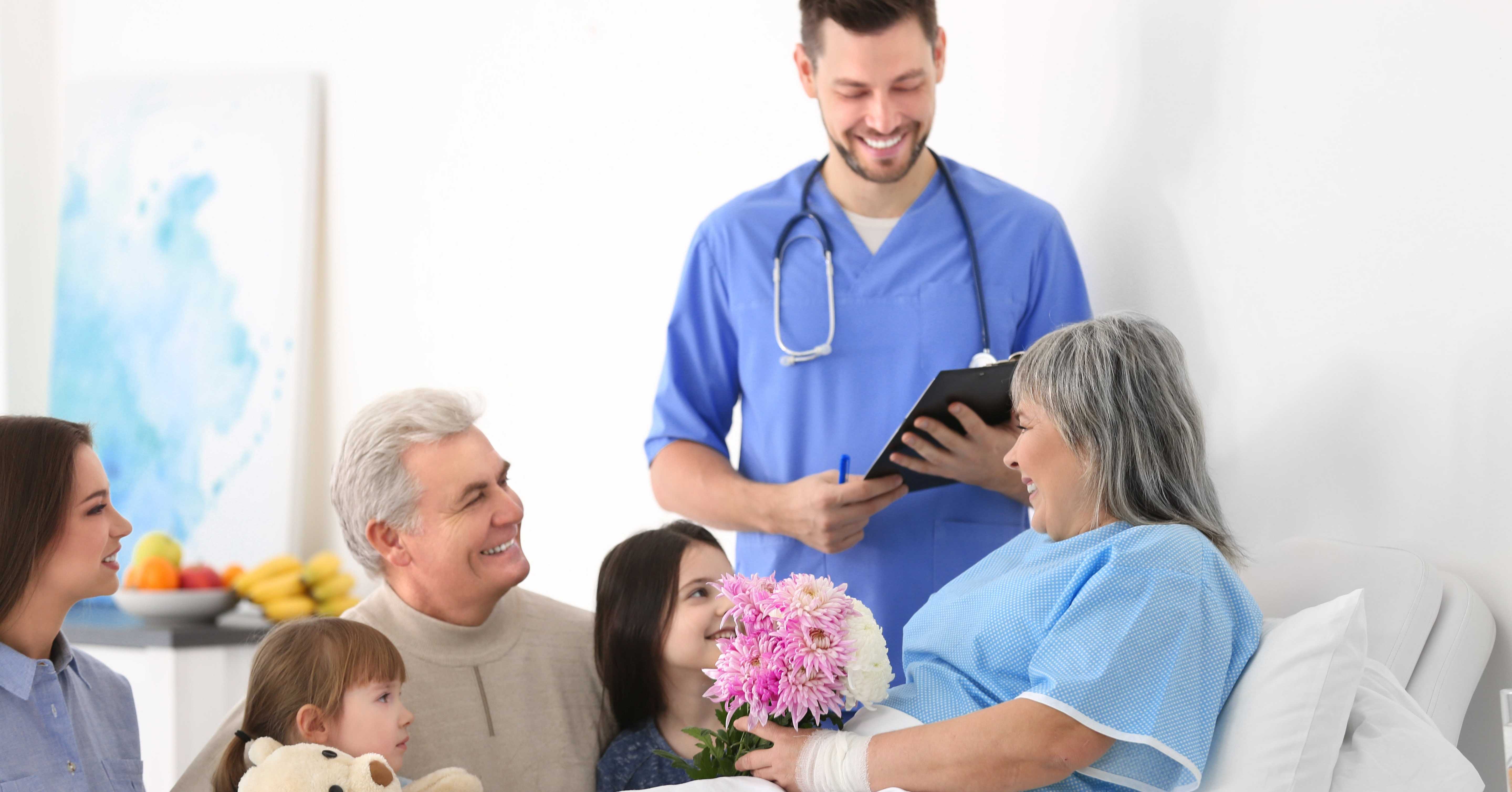 doctor, family and patient in hospital