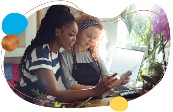 two business women on tablet