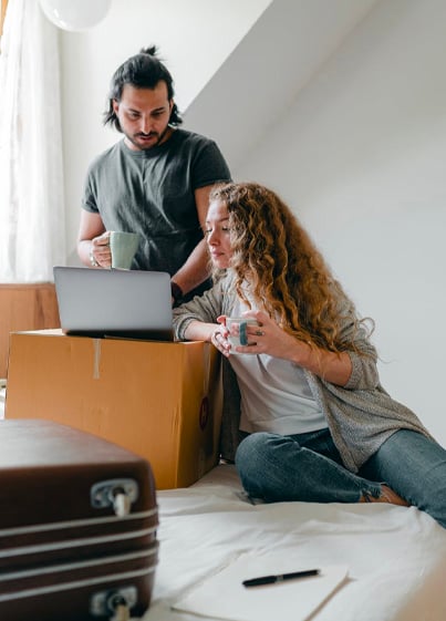 Multiracial couple waching laptop