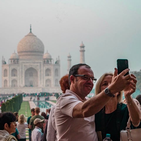 man taking selfie photo with monument