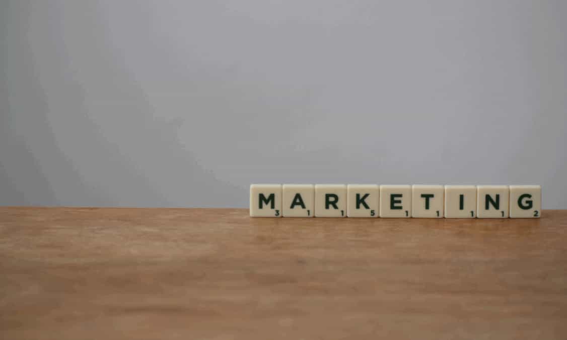 marketing spelled out in scrabble tiles