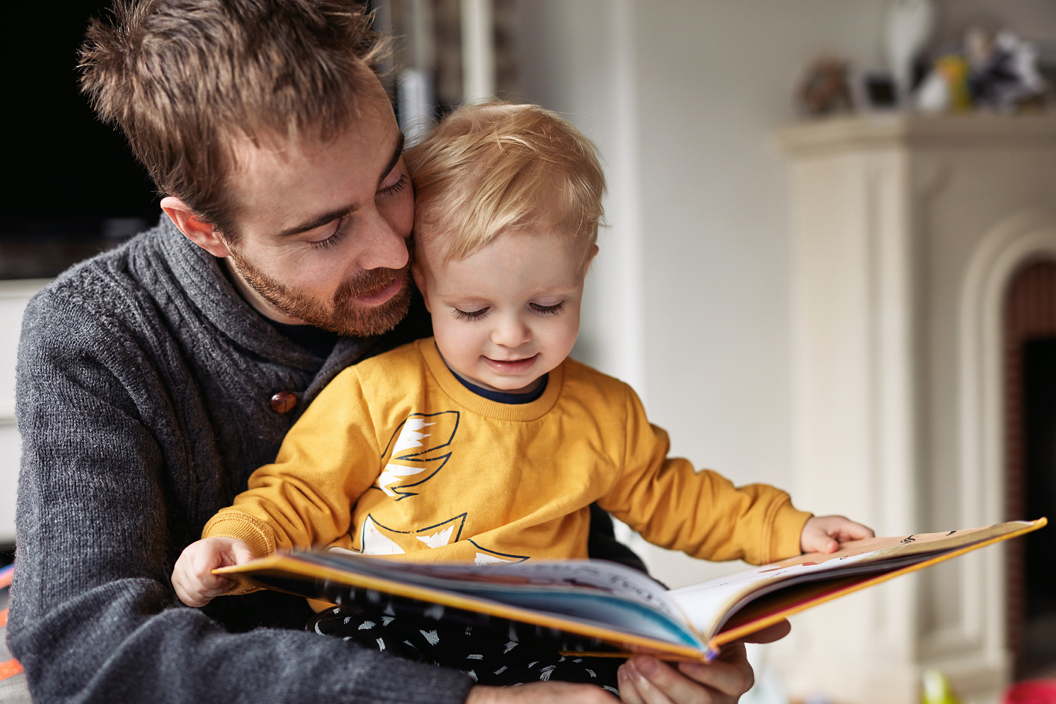 father reading to child