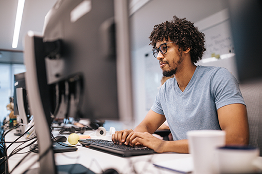 young man working on computer