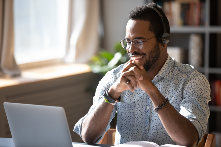 Smiling businessman holding video call with donors/clients/partners