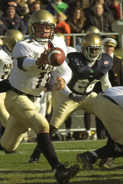 Navy quarterback, Craig Candeto, pitches the ball out