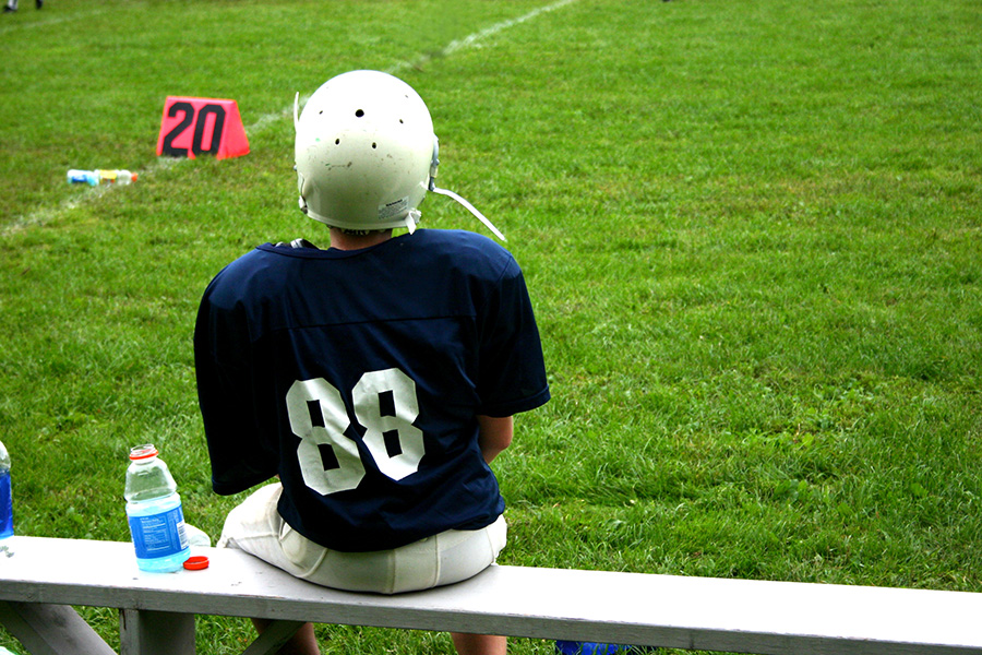 Football Player on the Bench - Resized