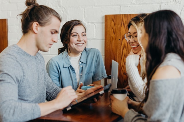 Four hip youngsters in conversation - small