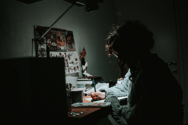 Woman at desk - nightime