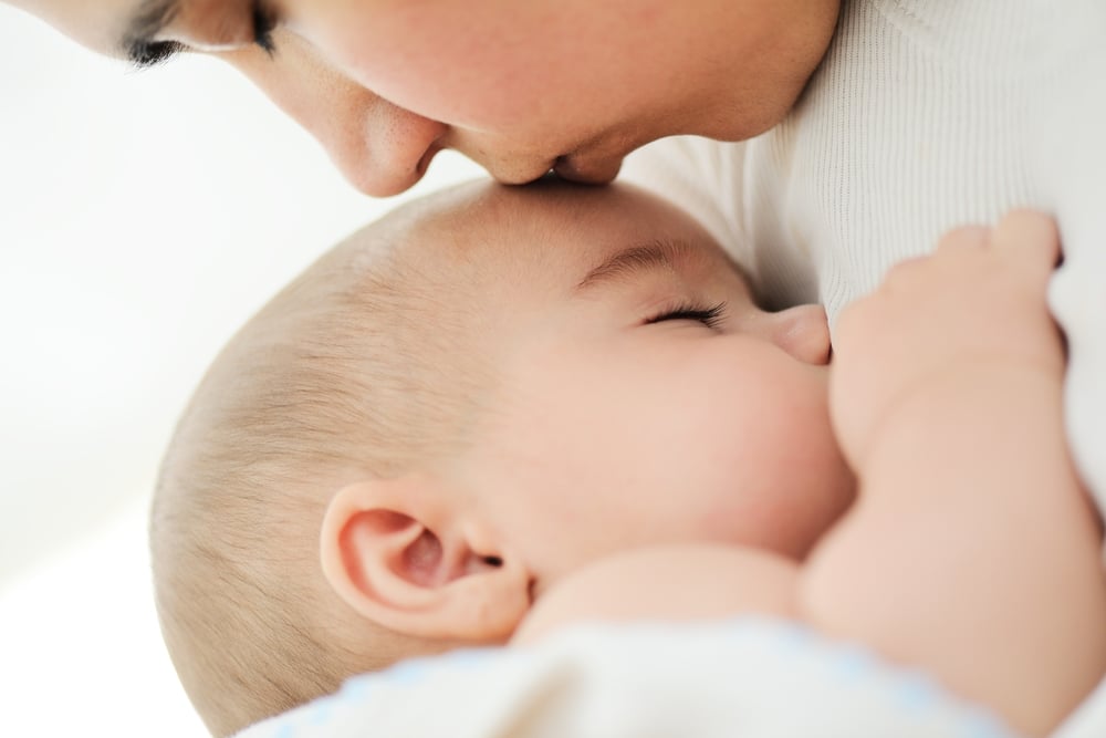 Baby having moms care