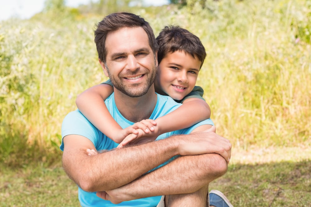 Father and son in the countryside on a sunny day