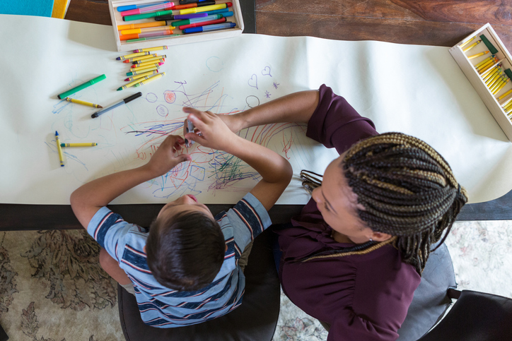 ABA-therapy-counselor-coloring-with-child