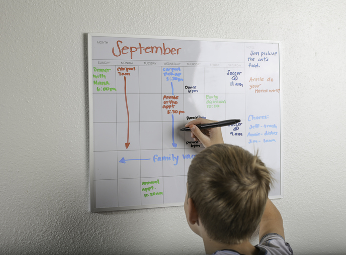 boy with autism using a written schedule