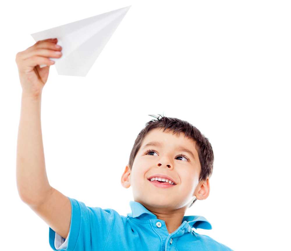 Boy holding a paper airplane - isolated over a white background