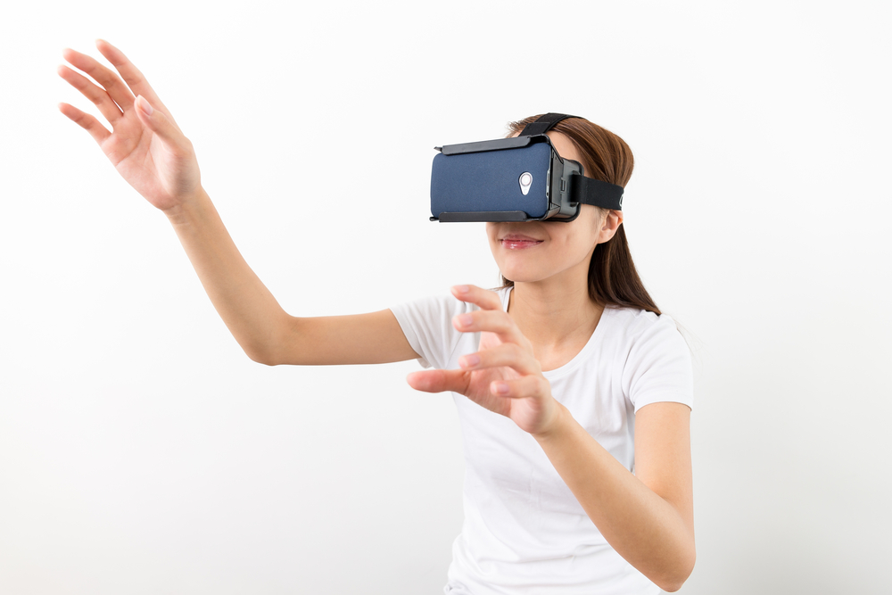 Young Woman experience virtual reality on cellphone
