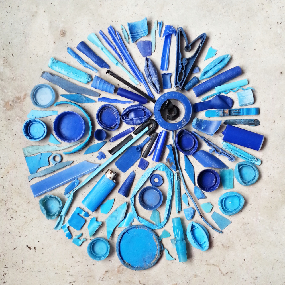 blue-plastic-pollution-collection-beach-reduce-waste-recycle-flat-lay-art-environment-global_t20_a7NQbY