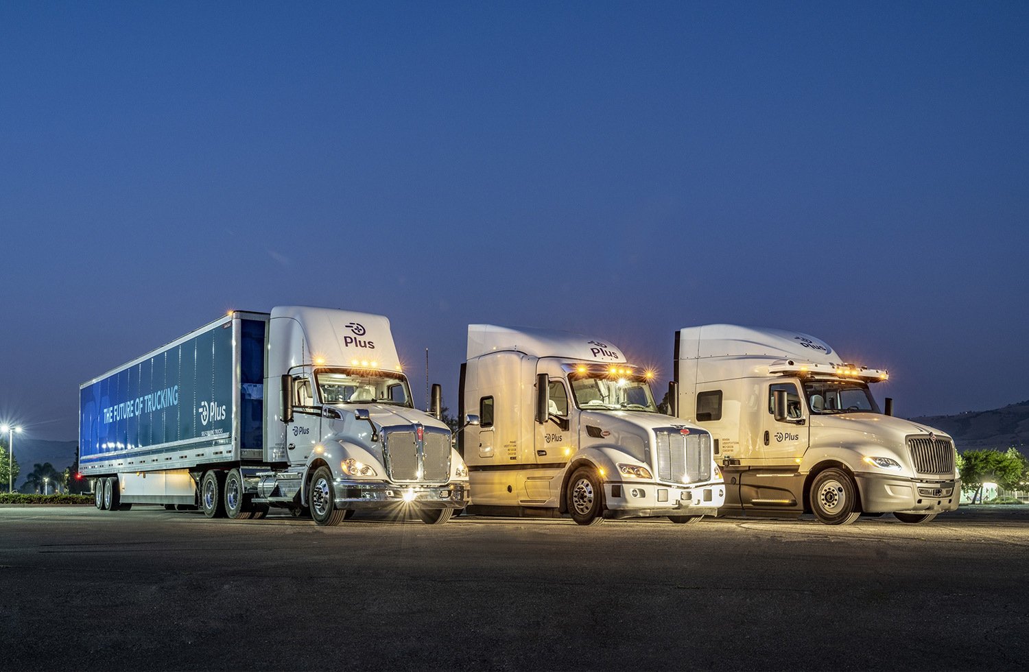 plus trucks lined up at night with ouster lidar sensors