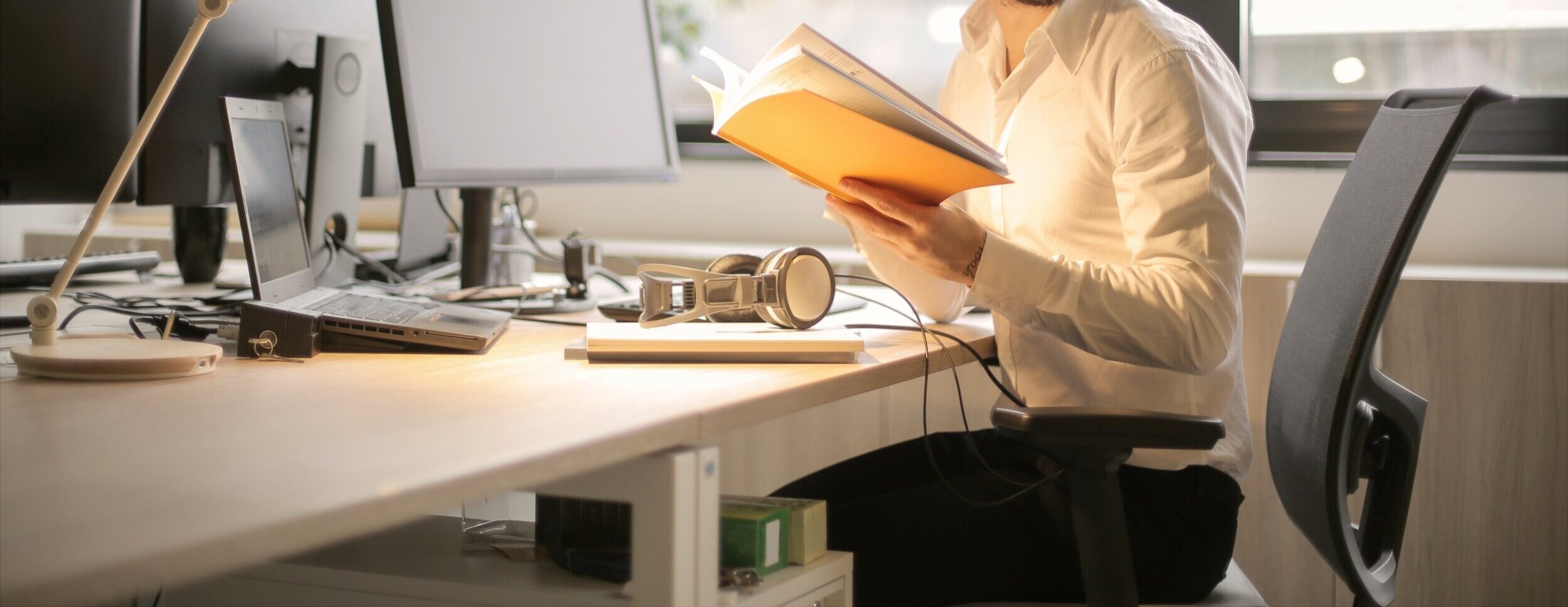 photo-of-man-holding-a-book-927022