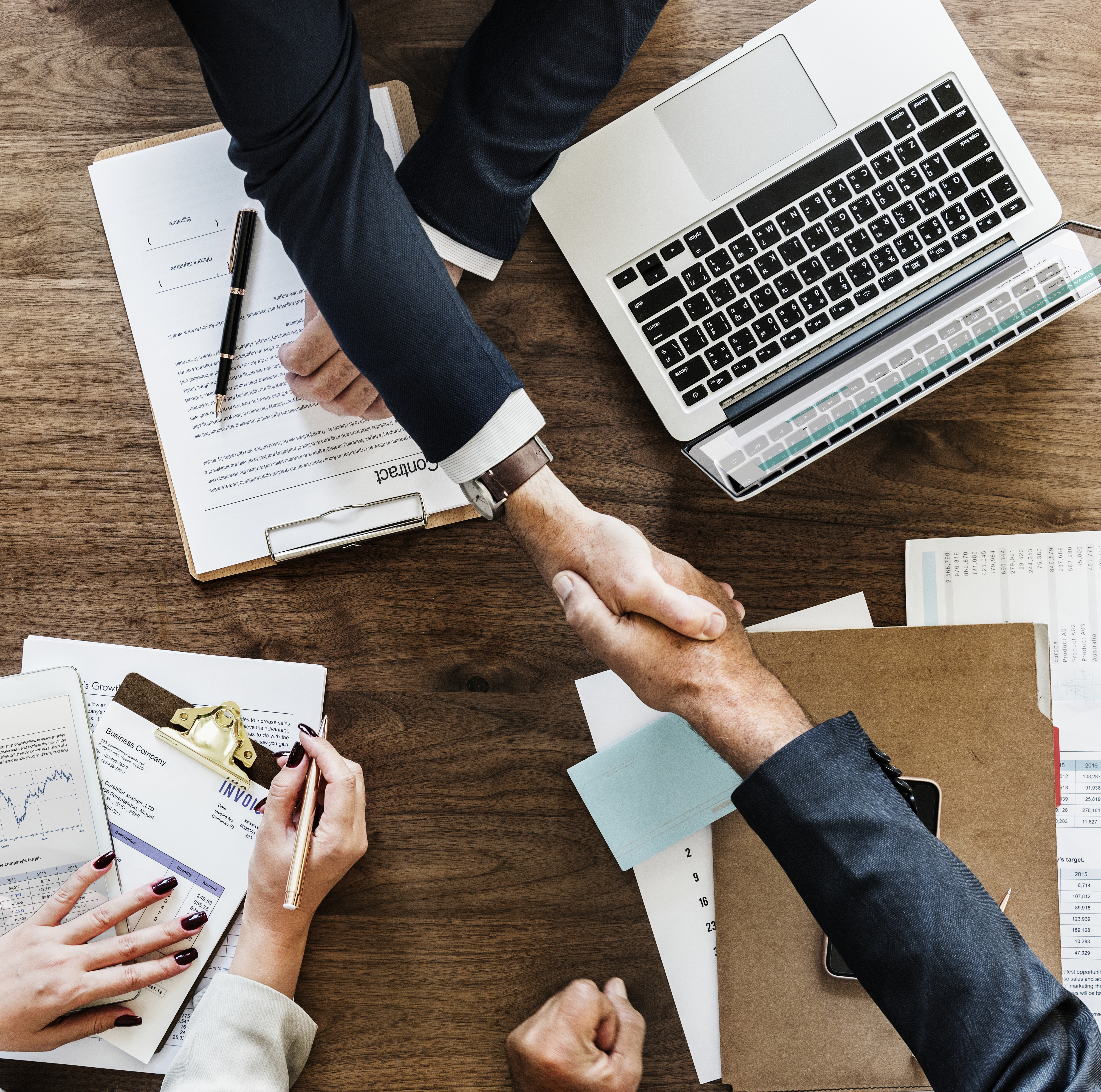 business-people-shaking-hands-together copy