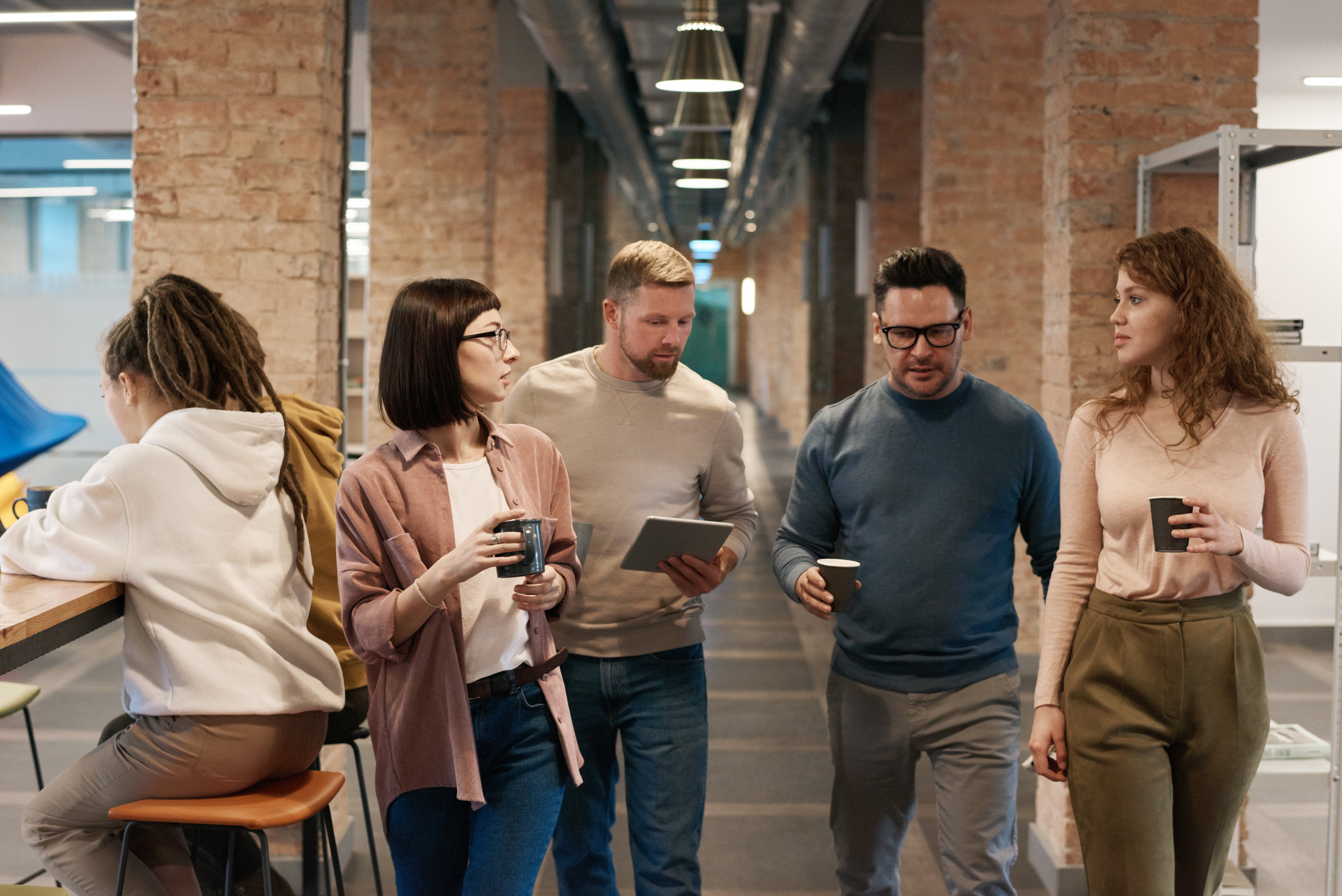 photo-of-people-walking-on-hallway-3182787