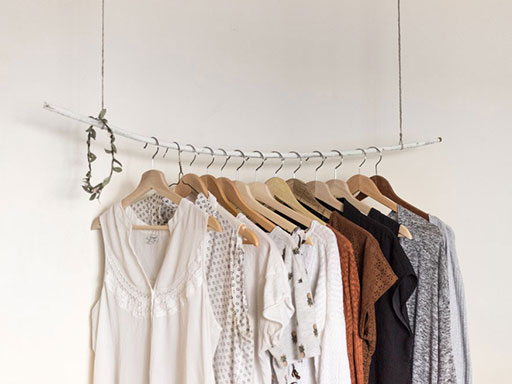 Women's blouses hanging on a metal rack